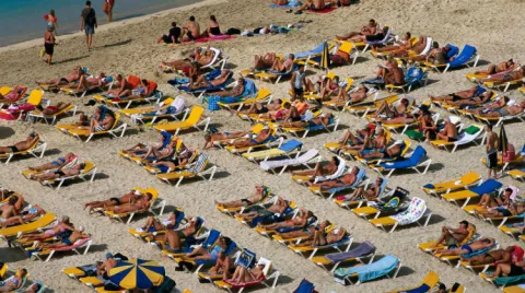 Turistas en la playa, Islas Canarias